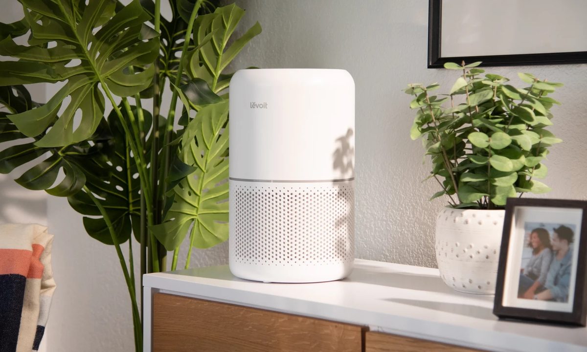 A Levoit Core 300 sitting on a console table.