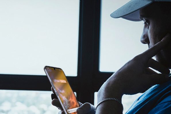 Man holding Phone feature image.