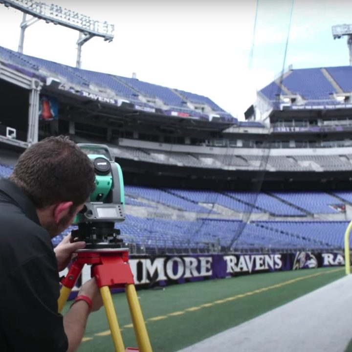 A man sets up RFID technology in the Ravens stadium.