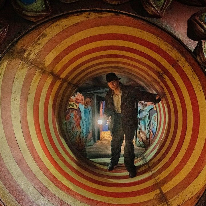 Bradley Cooper checks out a tunnel in Nightmare Alley.