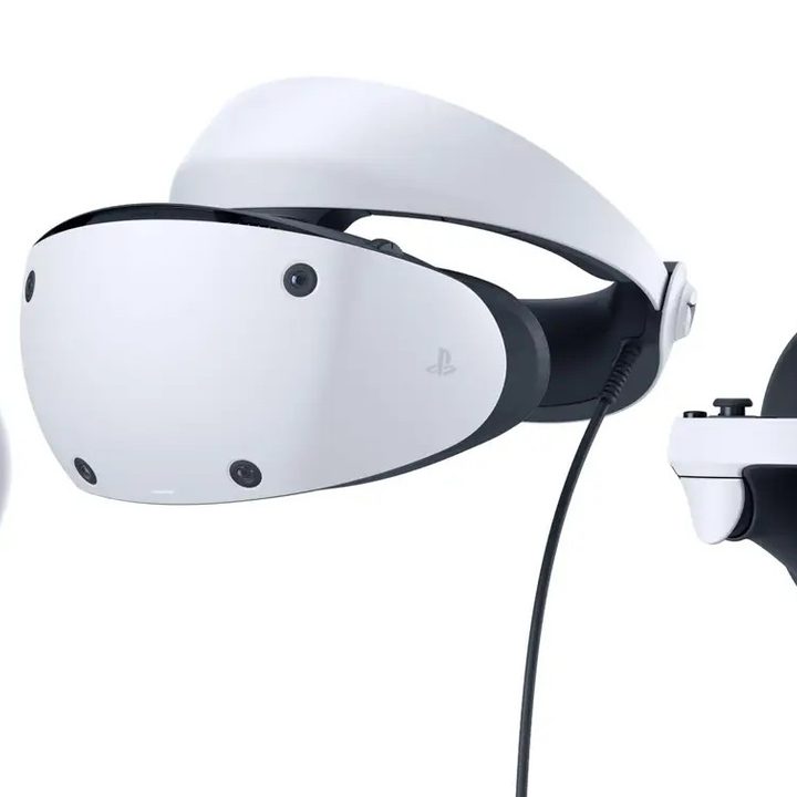 The PlayStation VR2 headset along with its controllers on a white background.