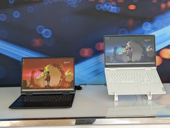 The black 16-inch IdeaPad Gaming 3 is open on the left next to the white 15-inch IdeaPad Gaming 3 open on the right.
