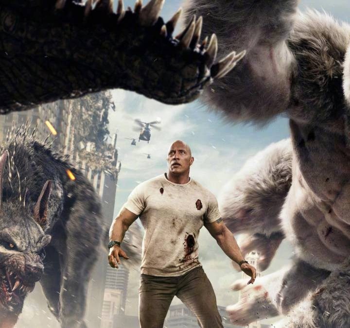 The Rock battles monsters in Rampage.