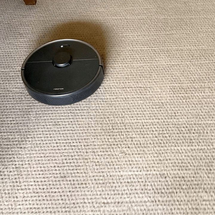 The Roborock S4 Max on tan carpet.