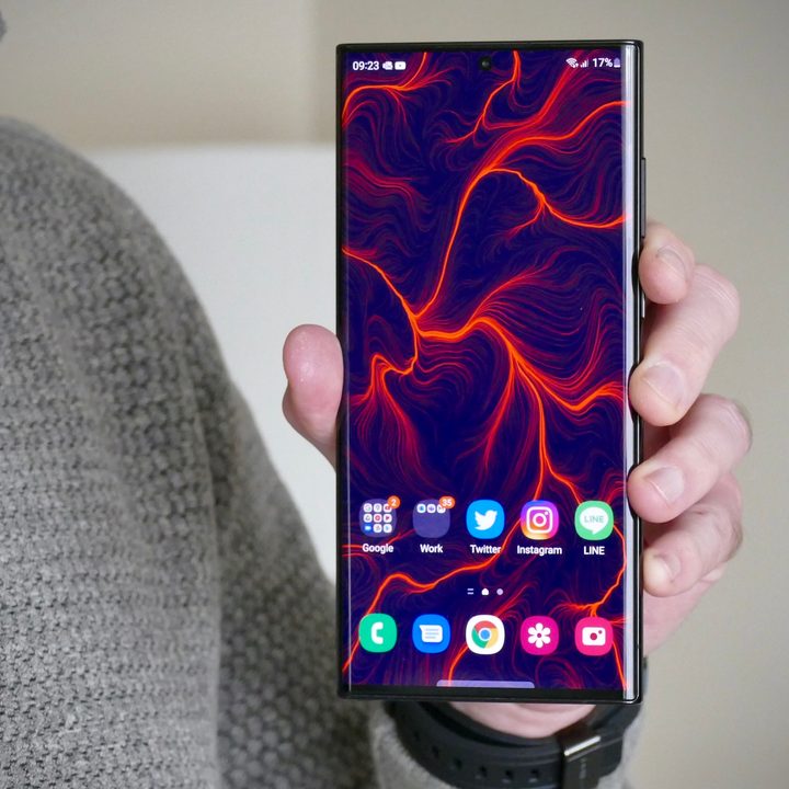 The Galaxy S22 Ultra held in hand.