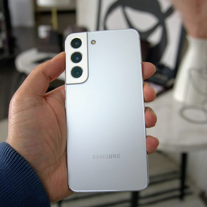 Samsung Galaxy S22 Plus in Phantom White in hand.