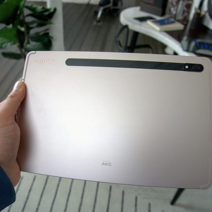 A Samsung Galaxy Tab S8 held up to show the color variation.