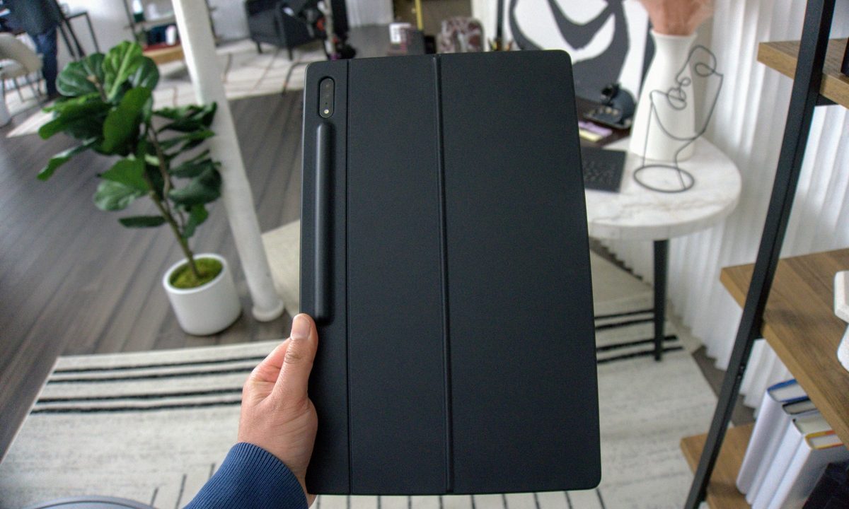 A Samsung Galaxy Tab S8 held up with a cover on.