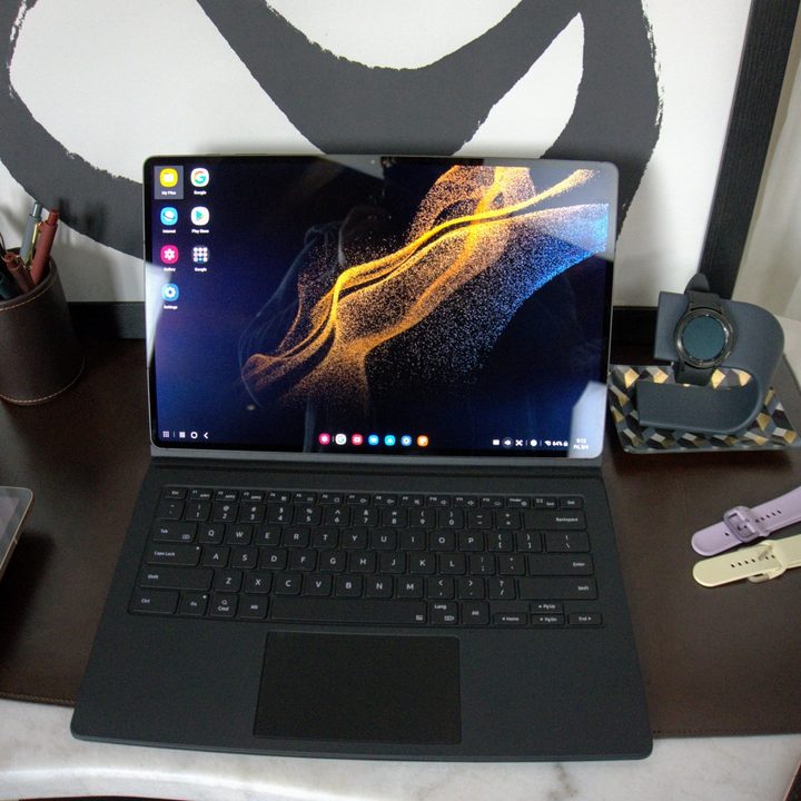 The Samsung Galaxy Tab S8 set up on a keyboard cover to work as a laptop.