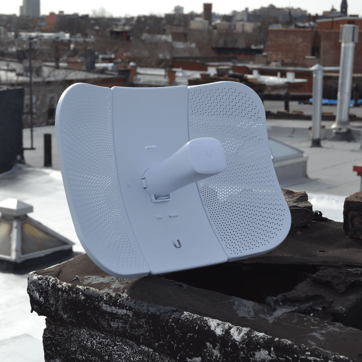 A NYC Mesh node antenna beams WiFi access to city residents.