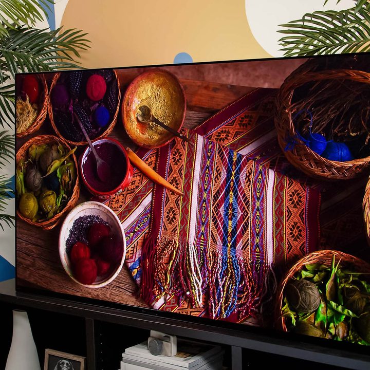 An image of foods, yarns, and a woven mat displayed on the Sony A95K TV.