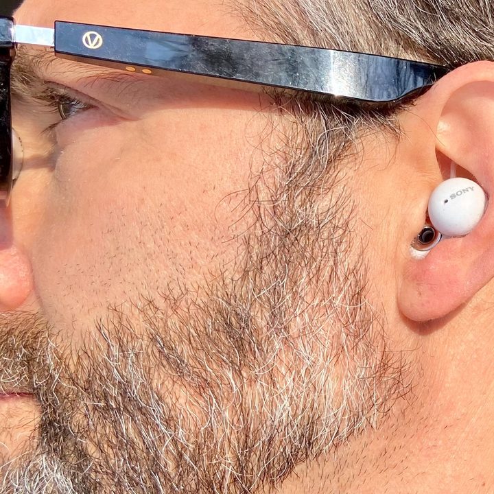 Man wearing Sony LinkBuds.