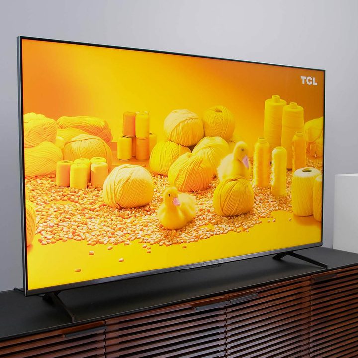 An all yellow image, comprised of ducks and yarn can be seen on the TCL 6-Series Google TV.