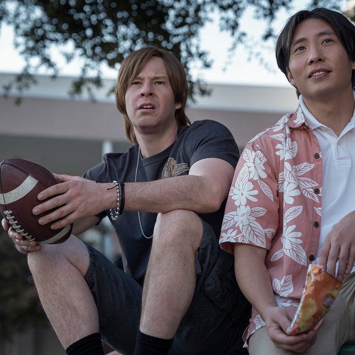 Brett (Ike Barinholtz) and Ned (Kelvin Yu) as high school students in The Afterparty on Apple TV+.