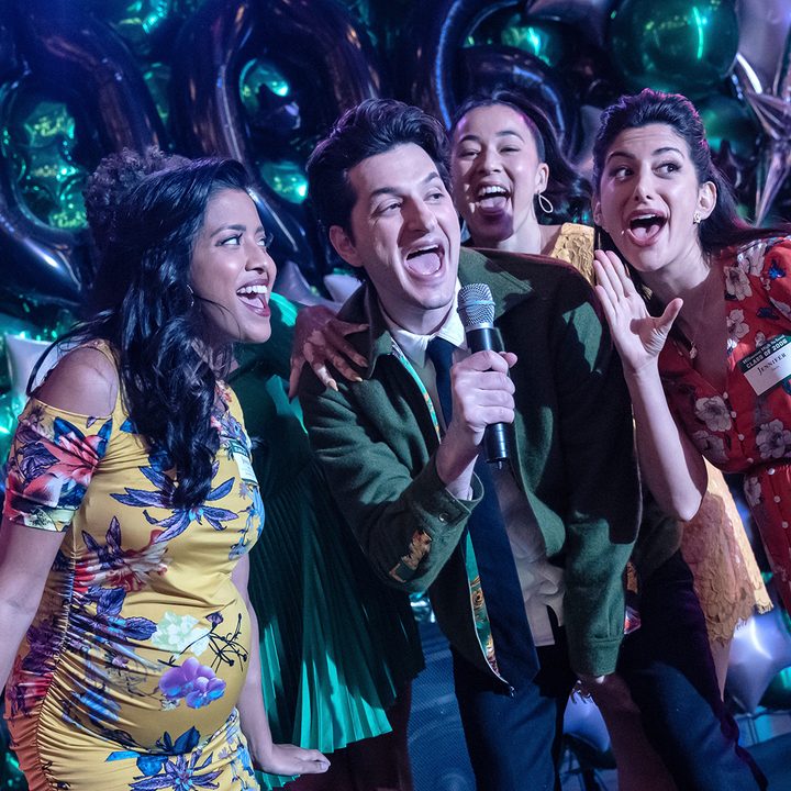 Yasper (Ben Schwartz) sings at the reunion in The Afterparty on Apple TV+.
