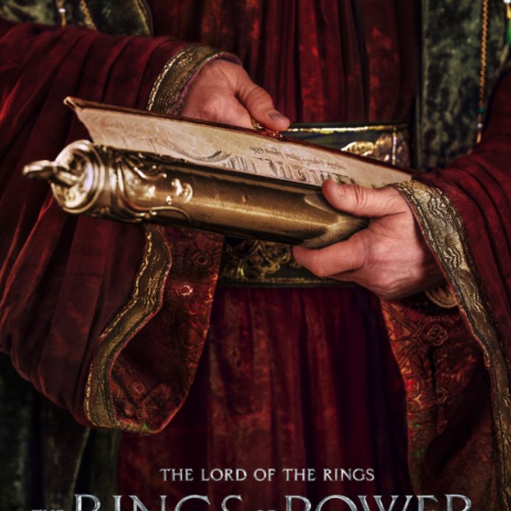 A scholar's hands in The Rings of Power.