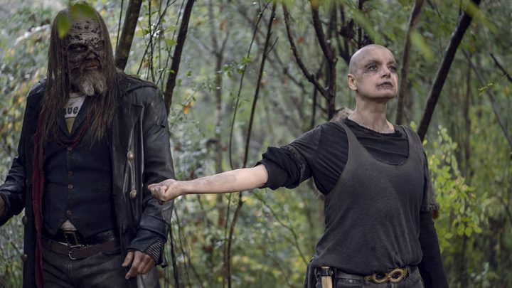 Alpha from The Walking Dead with her arms outstretched, Beta standing at her side.