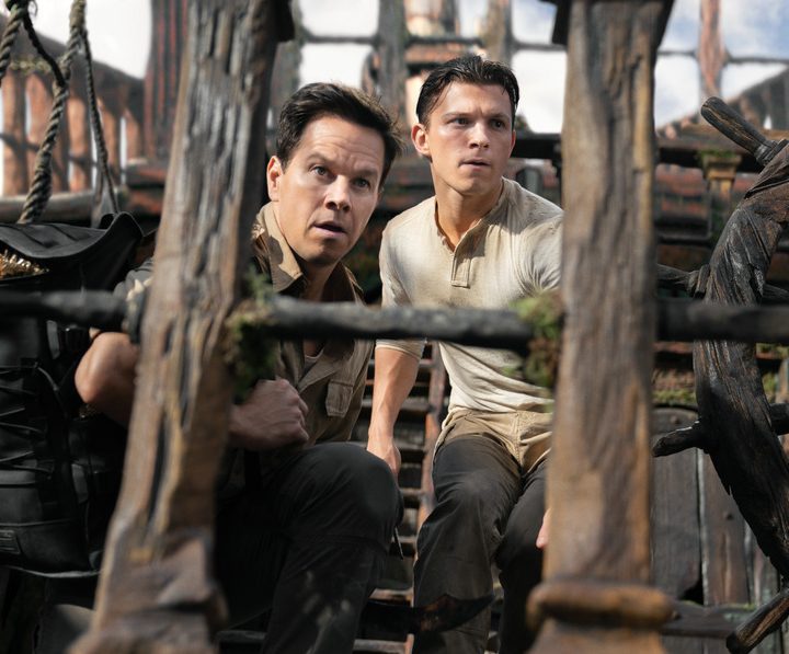Mark Wahlberg, from left, and Tom Holland on a pirate ship in Uncharted.
