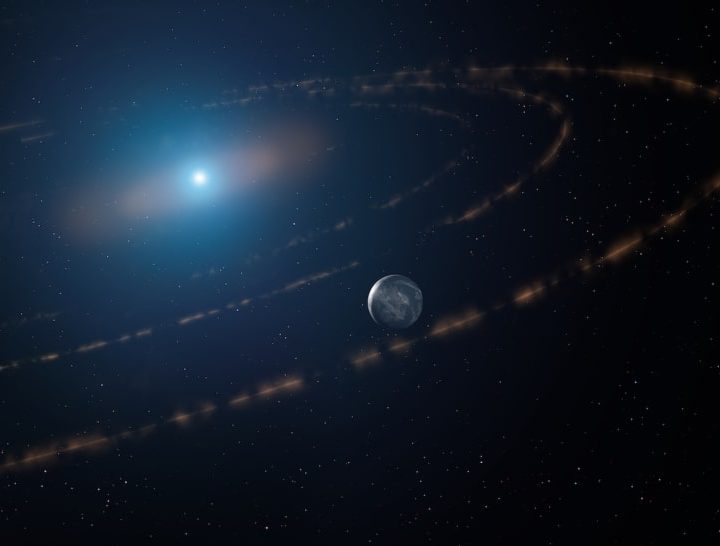 An artist’s impression of the white dwarf star WD1054–226 orbited by clouds of planetary debris and a major planet in the habitable zone.