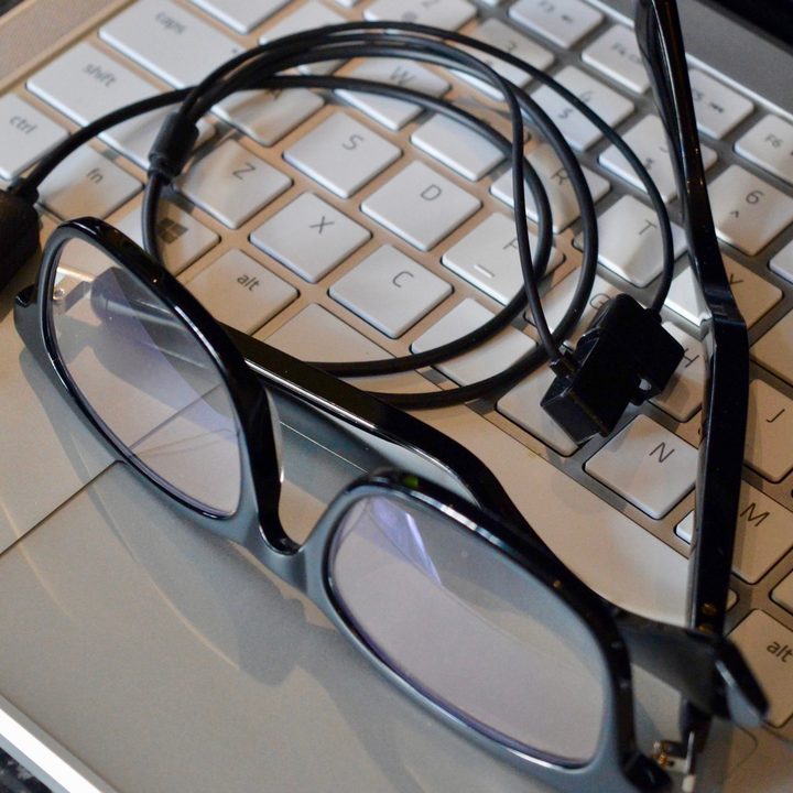 Vue Lite 2 audio glasses with charging cable.