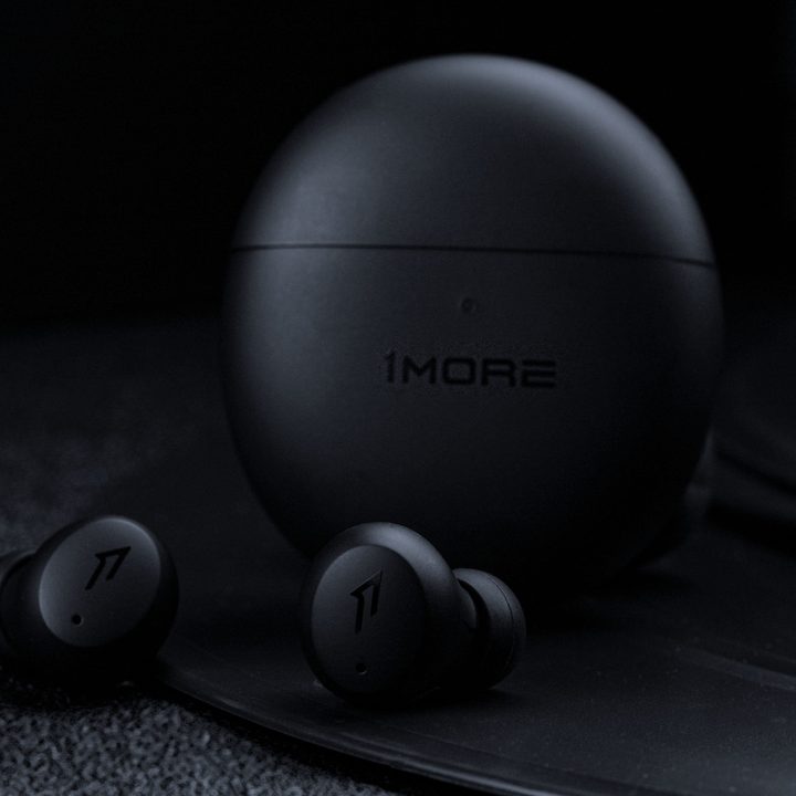 1More ComfoBuds Mini wireless earbuds seen in black.