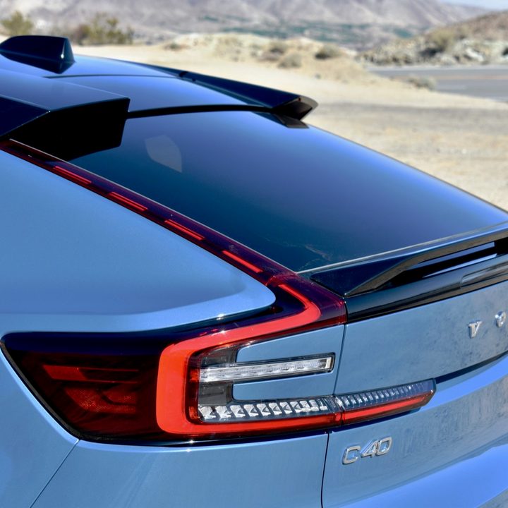 A close-up of the 2022 Volvo C40 Recharge electric car's taillights and rear spoiler.