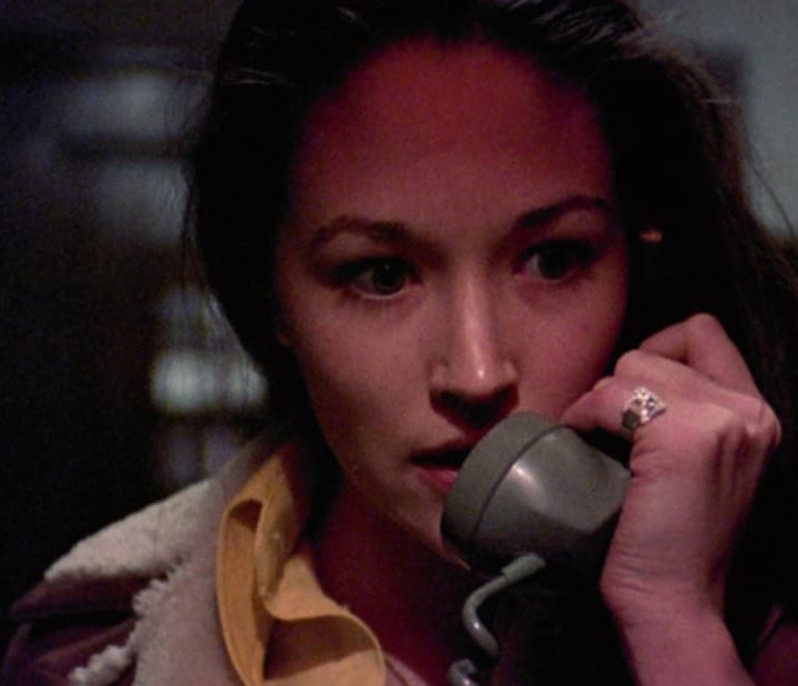 Jess answers the phone call from a stalker in Black Christmas