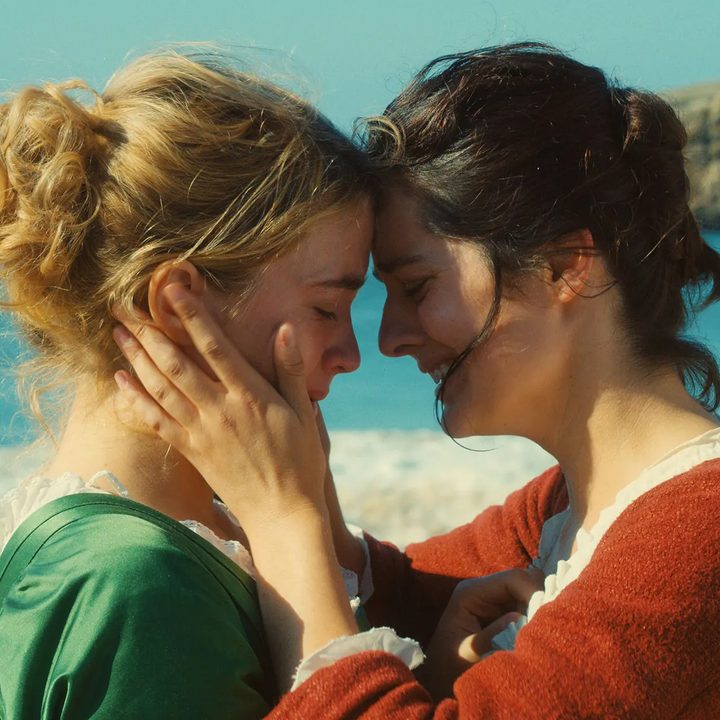Adèle Haenel and Noémie Merlant stand near the ocean in Portrait of a Lady on Fire.