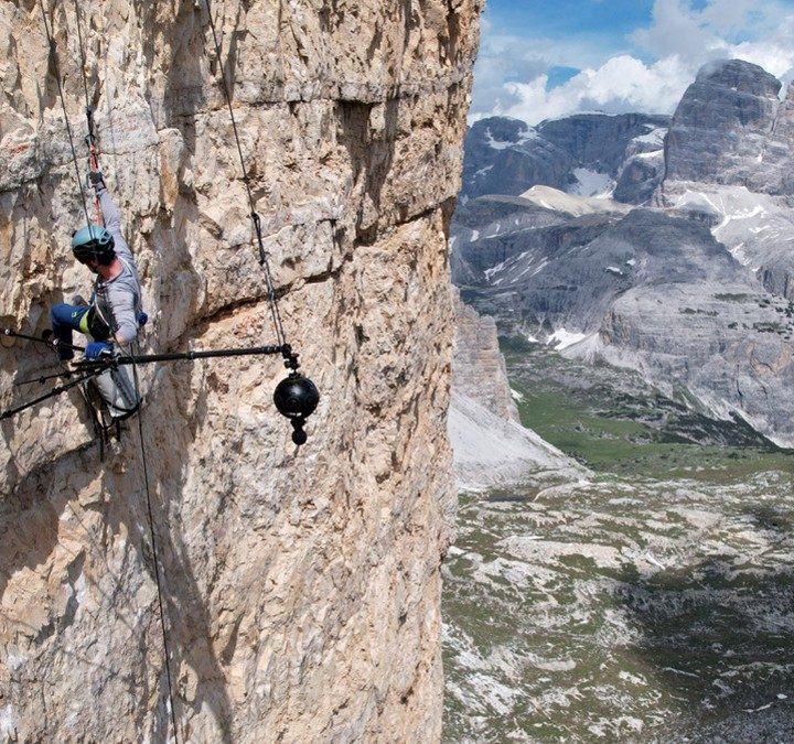 Alex Honnold climbs a rocky mountain outside in The Soloist VR.