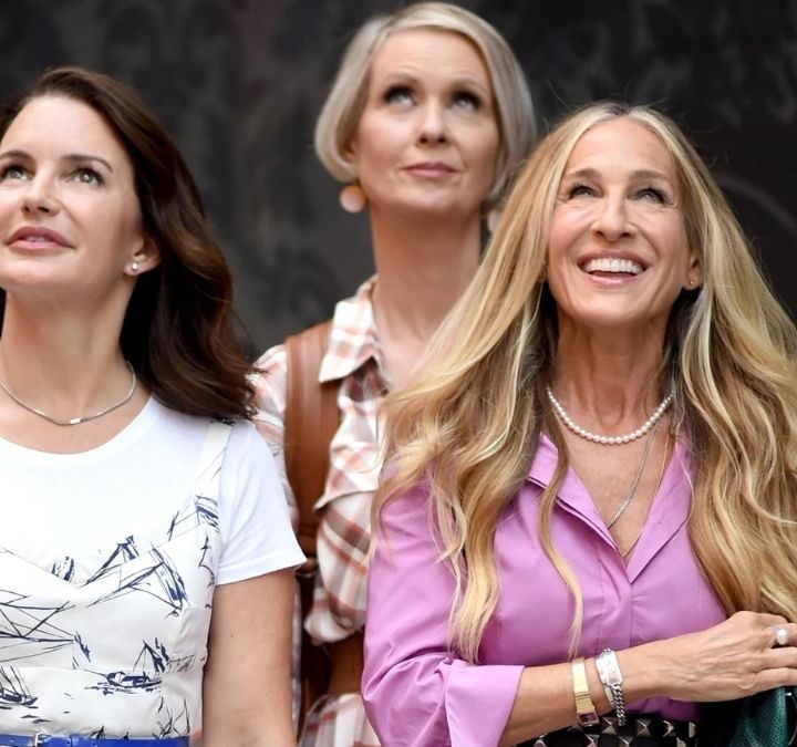 Charlotte, Miranda, and Carrie smiling and looking up in And Just Like That...