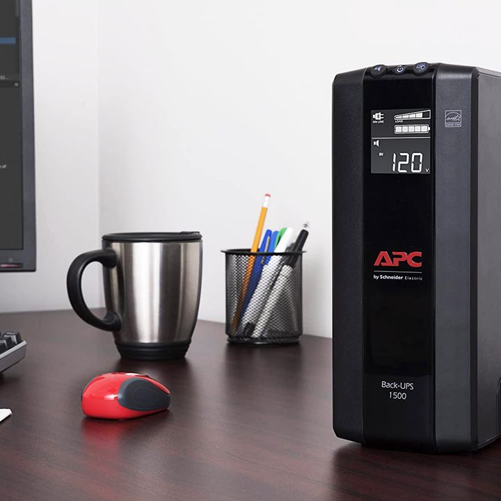 APC UPS backup battery sits on a desk.