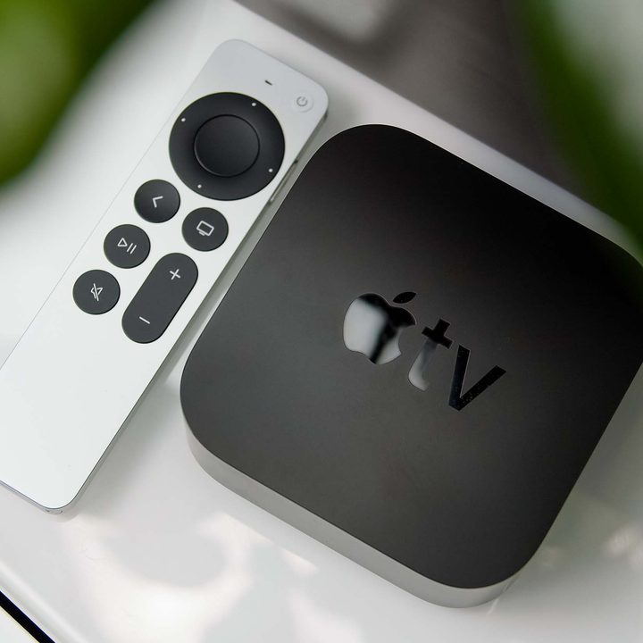 An Apple TV 4K sits on a media stand.