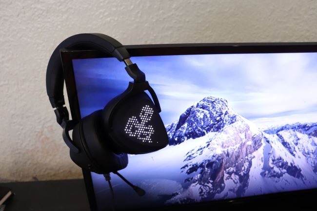 The Asus ROG Delta S Animate headset draped over a TV.