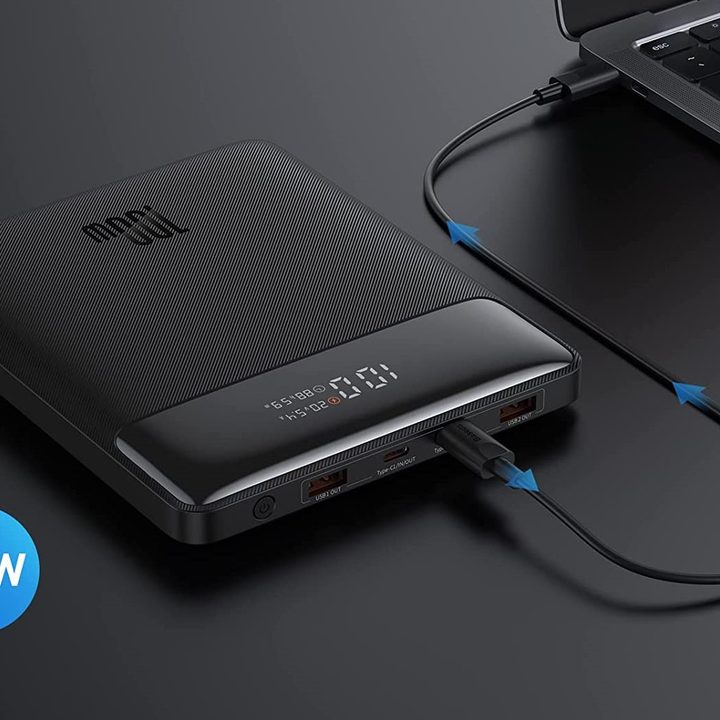 Baseus Blade Power Bank plugged into laptop charging it.