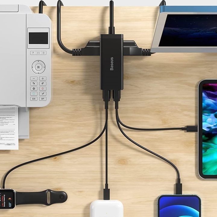 Baseus PowerCombo Power Strip plugged into so many devices.