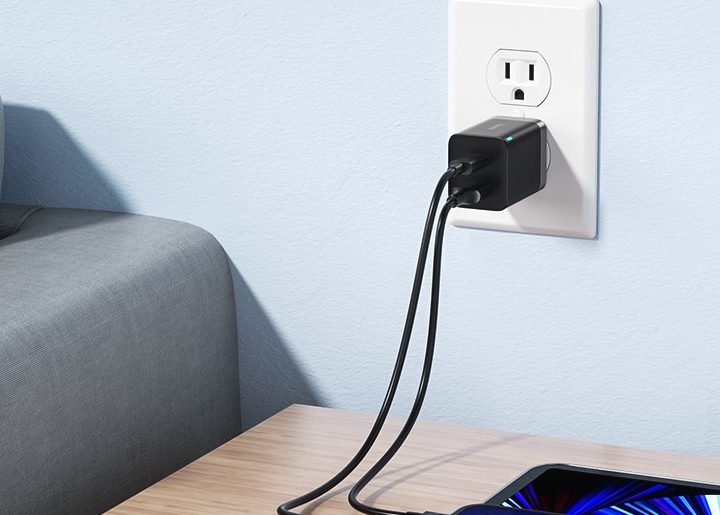 Baseus SuperSI 30W wall charger plugged into outlet.