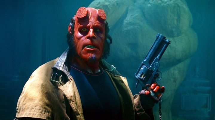 Ron Perlman cocks his gun in Hellboy (2004), directed by Guillermo del Toro.