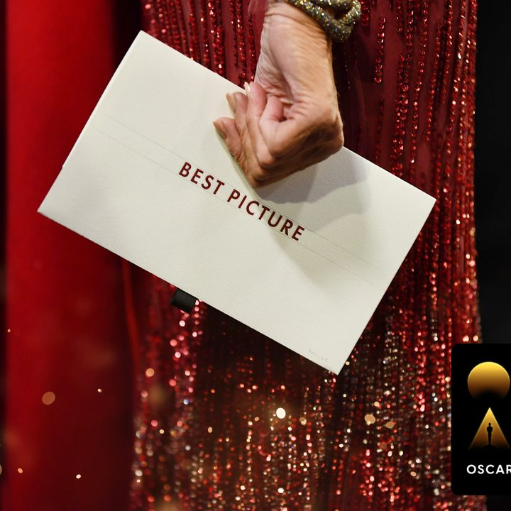 A woman holds an envelope that reads Best Picture at the Oscars.