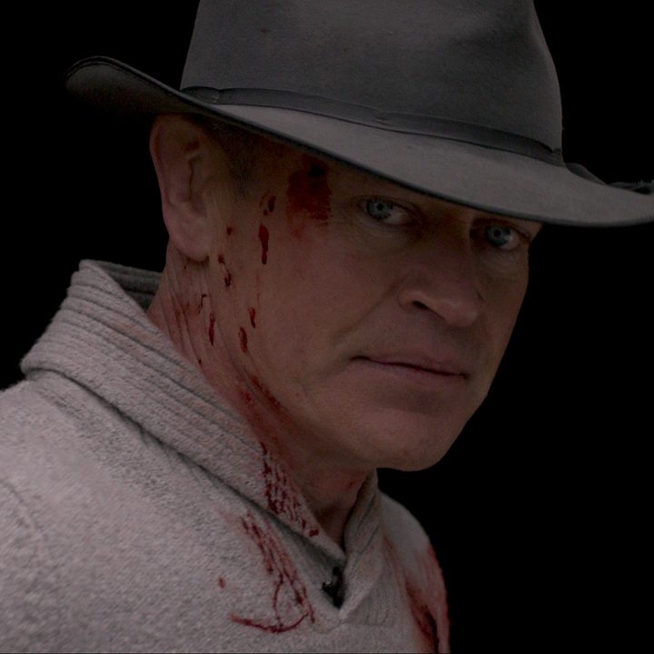 Neal McDonough stares with blood coming down his face in Boon