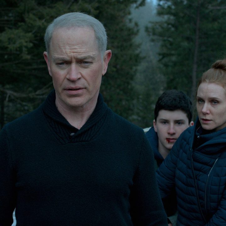 Neal McDonough stands in front and protects Jake Melrose and Christiane Seidel in a scene from Boon.