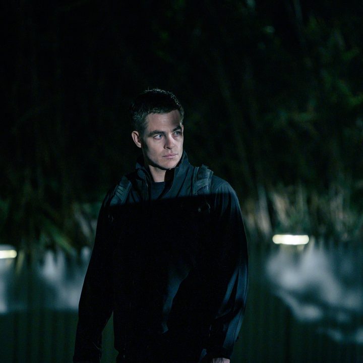 Chris Pine stands in the shadows in a scene from The Contractor.