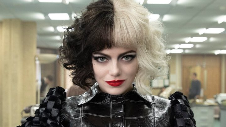 Cruella stares at the camera in Cruella.