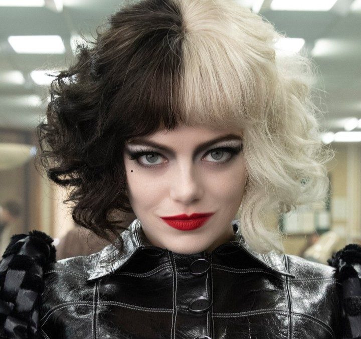 Cruella stares at the camera in Cruella.
