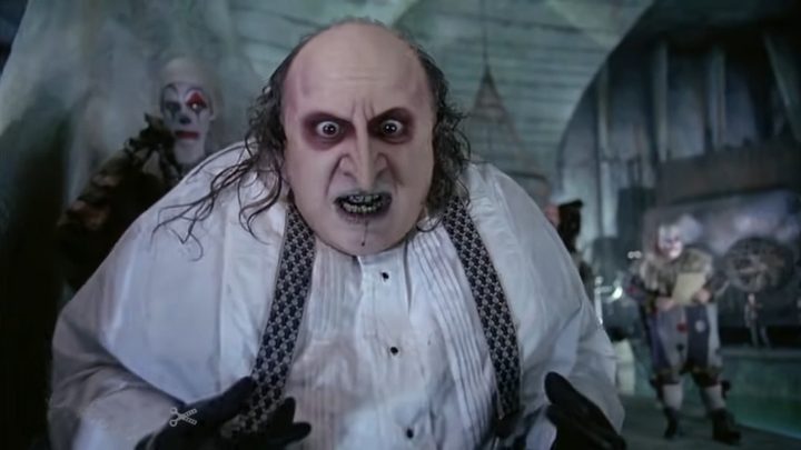 The Penguin looks on in disbelief in his sewer lair in Batman Returns.