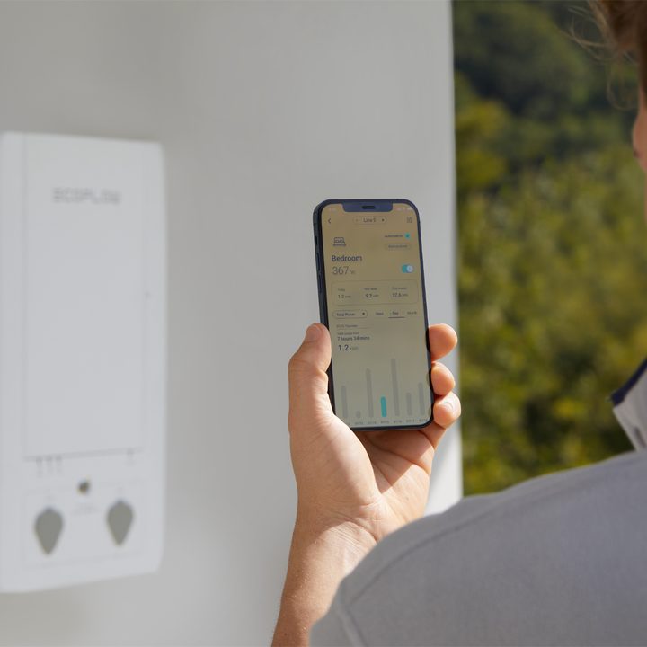 A man using the EcoFlow app on his phone.