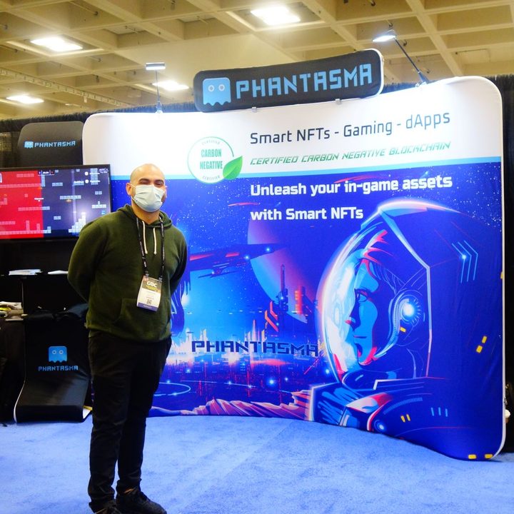 A Game Developers Conference 2022 booth advertises Smart NFTs.