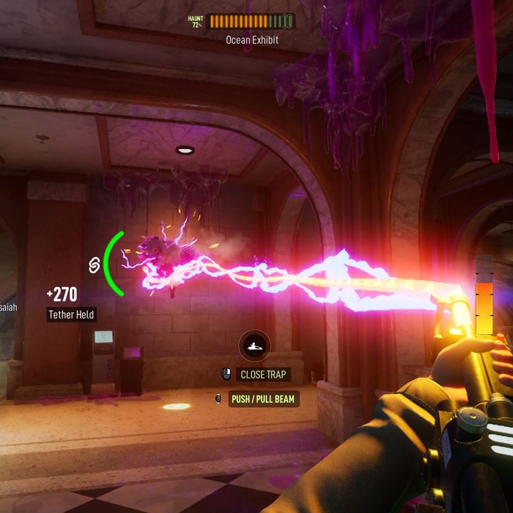 A player tries to capture a ghost with a trap and Particle Thrower in Ghostbusters: Spirits Unleashed.