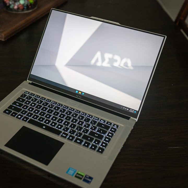 The Gigabyte Aero 16 laptop sitting on a table.