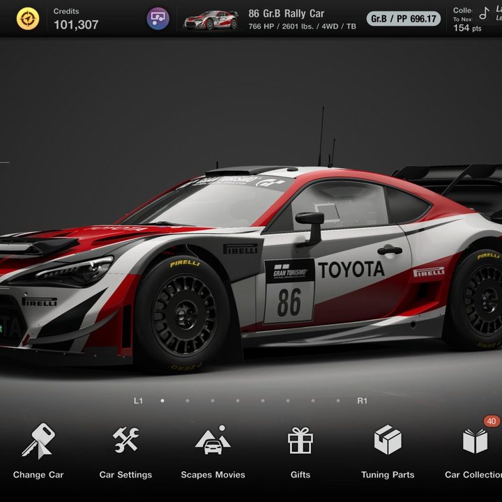 The 86 Gr.B Rally car sits in the garage in Gran Turismo 7.