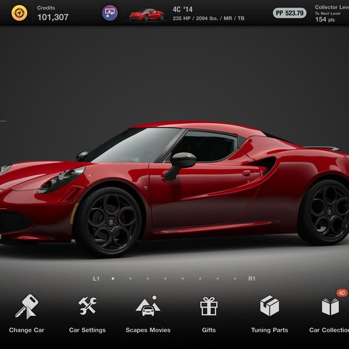 An Alfa Romeo sits in the garage in Gran Turismo 7.